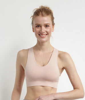 Seamless bra in almond pink Dim Sport